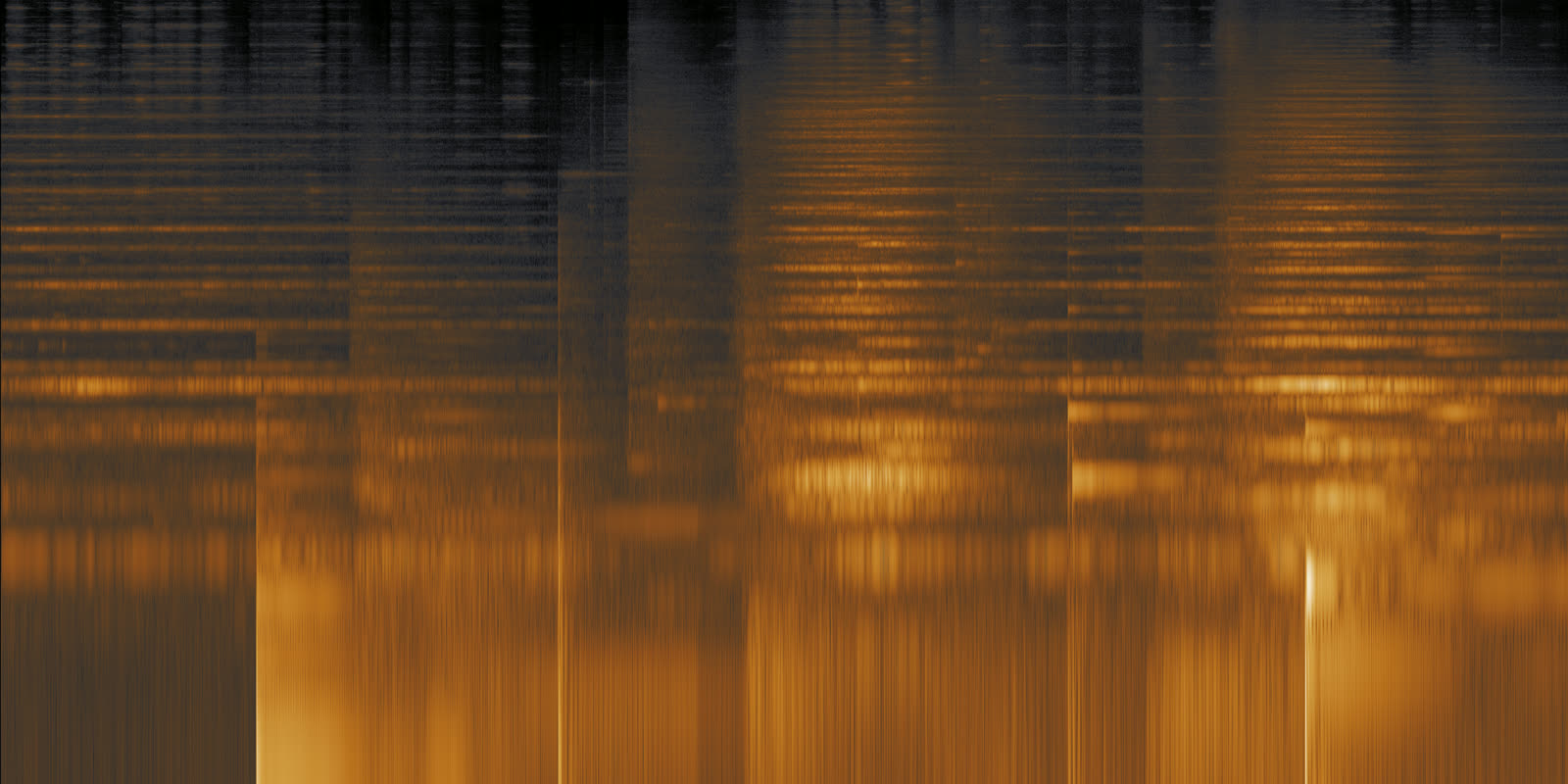Spectrogram in amber tones showing piano notes with long fading tails